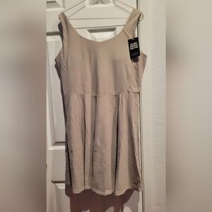 Tan color sport dress.